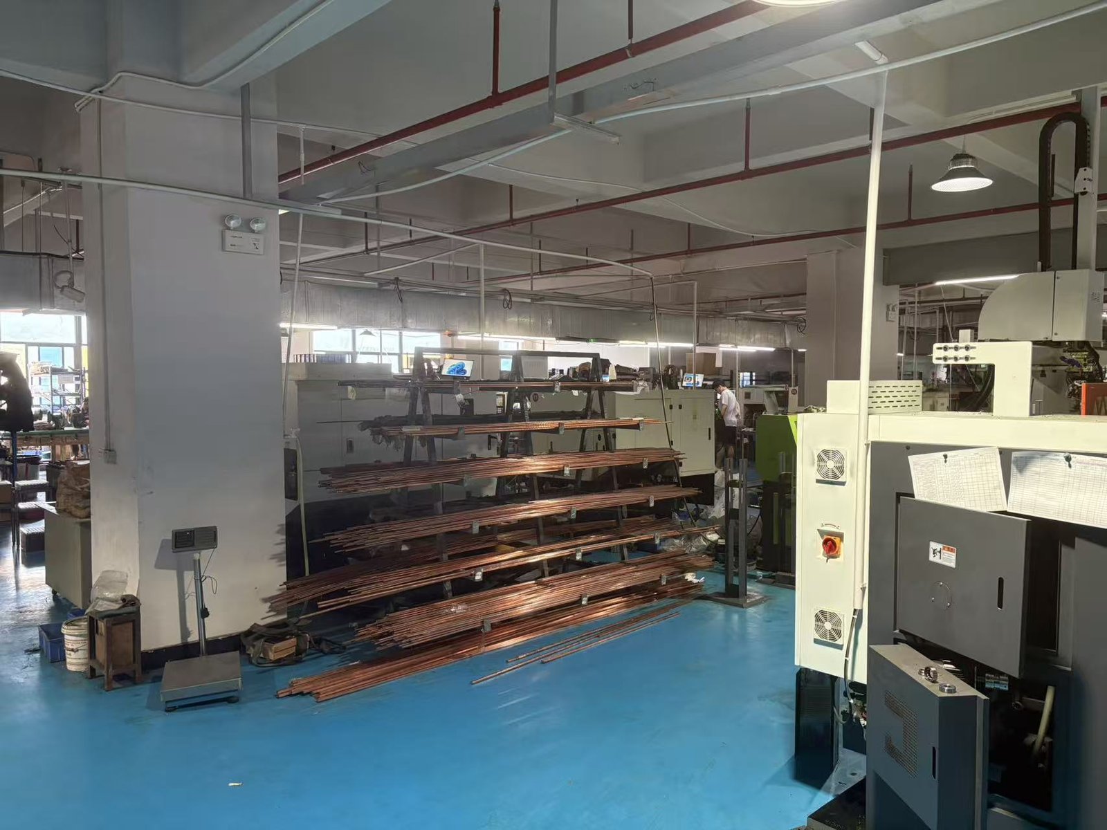 Copper rod inventory and production workshop interior at soldering tip manufacturing facility